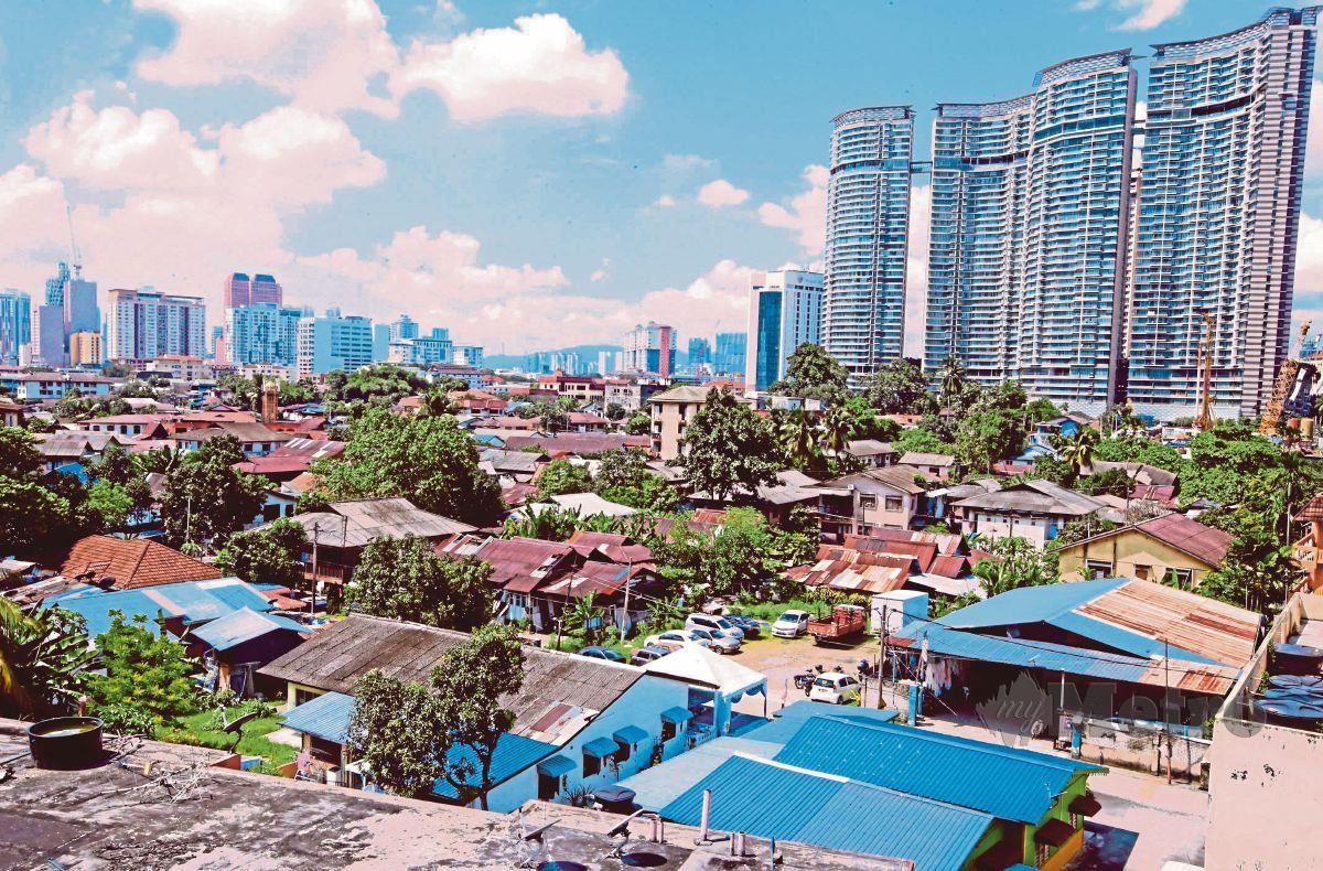 The contrast between the past and present as the community is increasingly surrounded by high-rises. - Pic courtesy of Fuad Fahmy