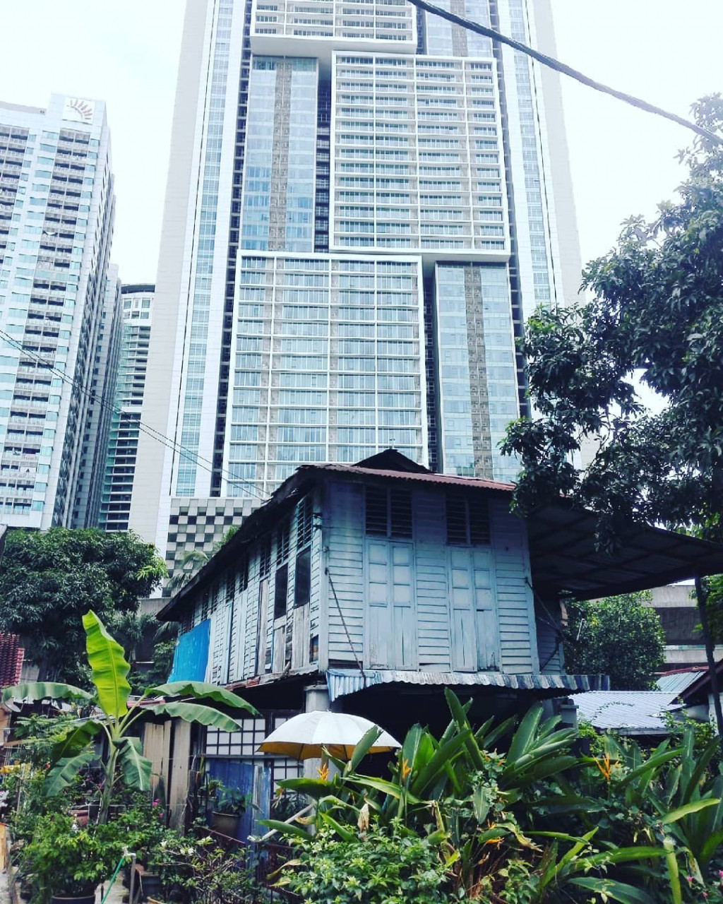 The contrast between the past and present as the community is increasingly surrounded by high-rises. - Pic courtesy of Fuad Fahmy