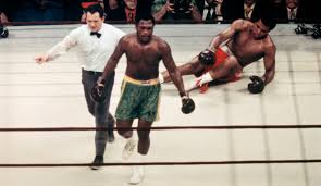 Frazier walks away after knocking Ali down