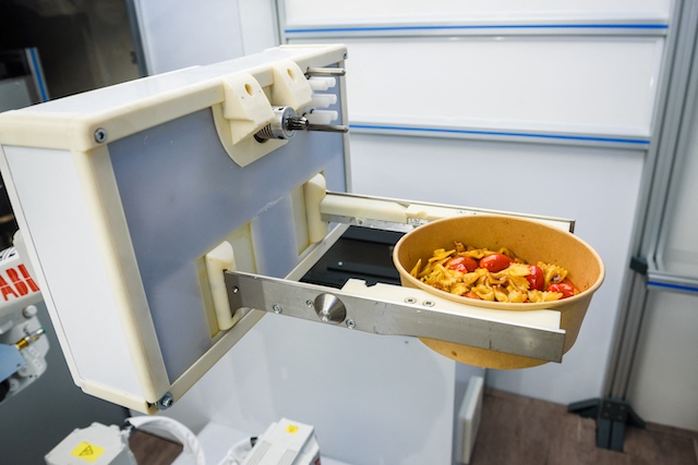 Kitchen robot in Riga cooks up new future for fast food 