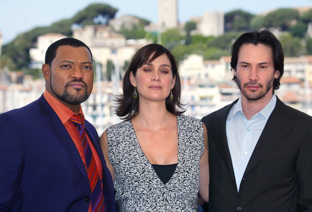 (From left) The main cast of the original Matrix trilogy, Laurence Fishburne, Carrie-Anne Moss and Keanu Reeves in Cannes in May 2003. While the latter two are returning for 'Resurrections', Fishburne is not. – AFP pic