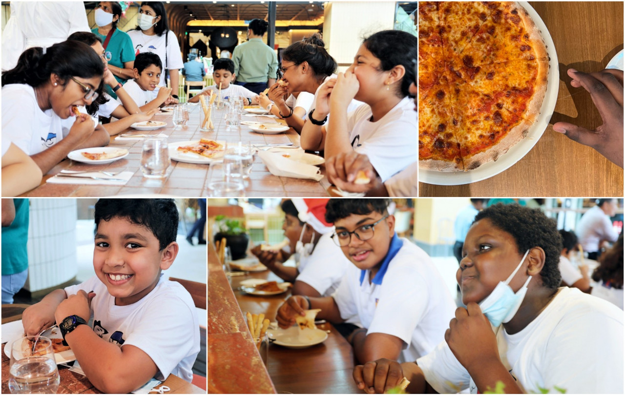 Kids of the Lighthouse Children Welfare Home Association enjoying their meal after their Christmas carolling. – Pic courtesy of Petra Cucina
