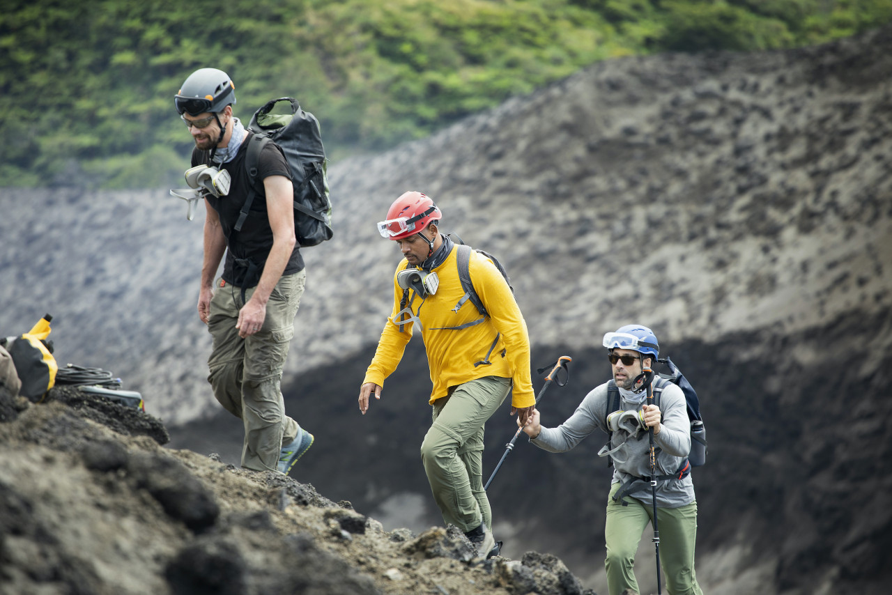 Will Smith (in yellow), volcanologist Jeff Johnson (in black) and explorer Erik Weihenmayer. – Pic courtesy of National Geographic for Disney+