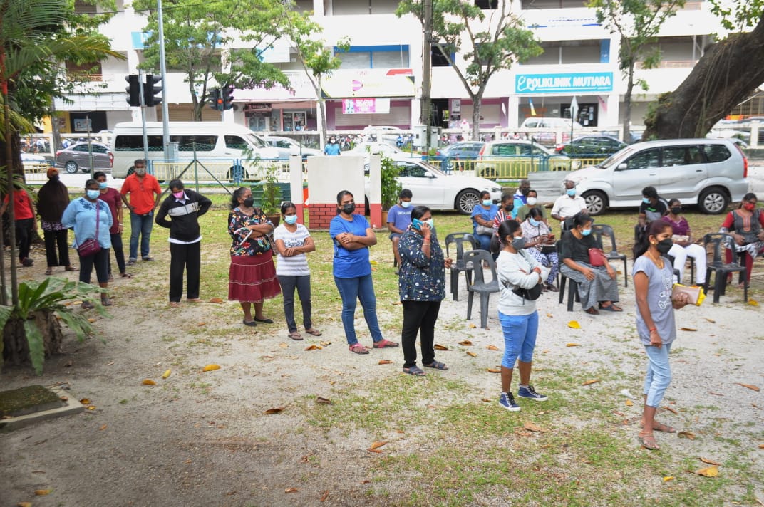 Some of the 150 families queueing for the aid. – PHA pic