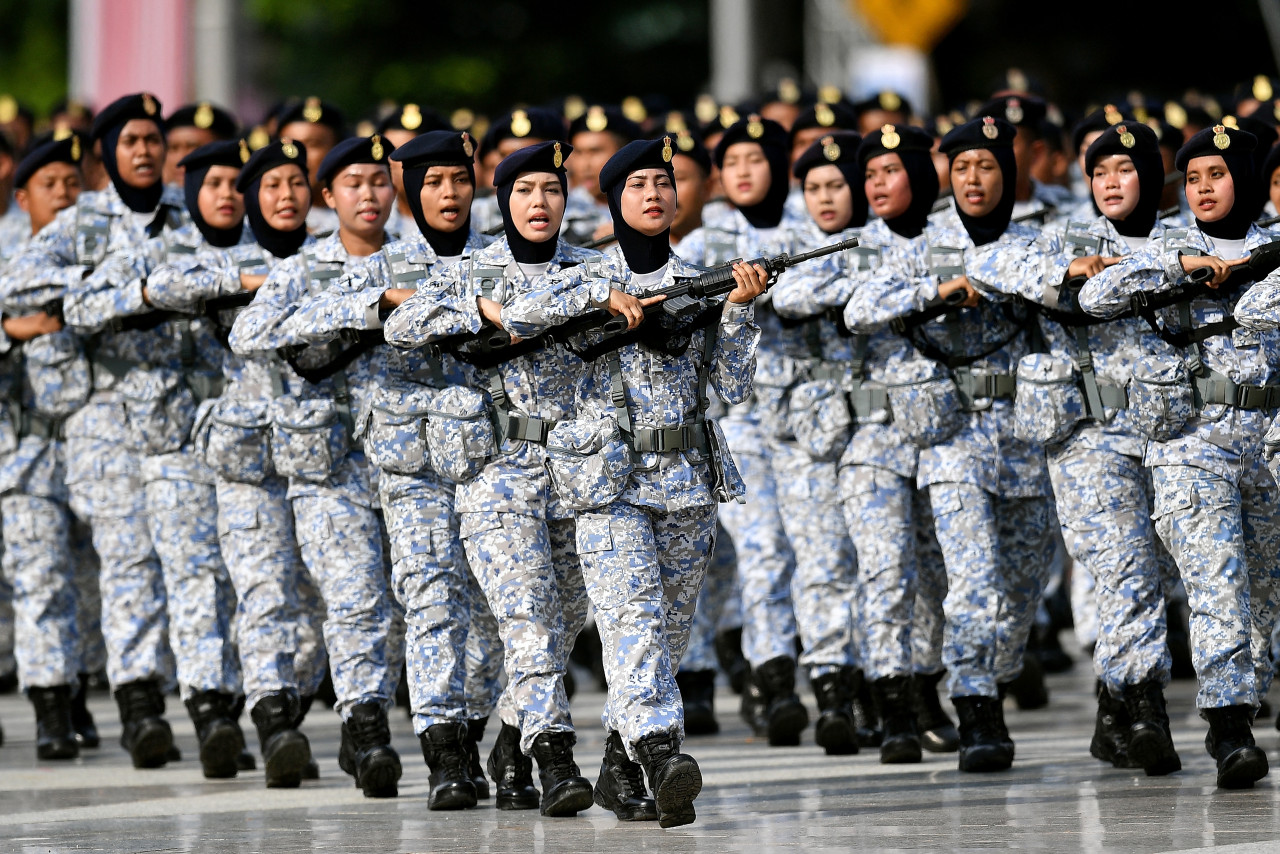 Women in uniform marching steadfast during one of the Merdeka parades in the past. – AFP pic 