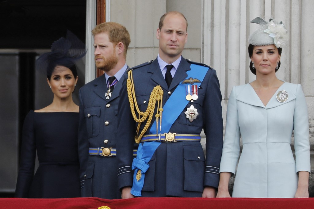 (From left) Britain's Meghan, Duchess of Sussex, Britain's Prince Harry, Duke of Sussex, Britain's Prince William, Duke of Cambridge and Britain's Catherine, Duchess of Cambridge, standing on the balcony of Buckingham Palace to watch a military fly-past to mark the centenary of the Royal Air Force on July 10, 2018. – AFP file pic