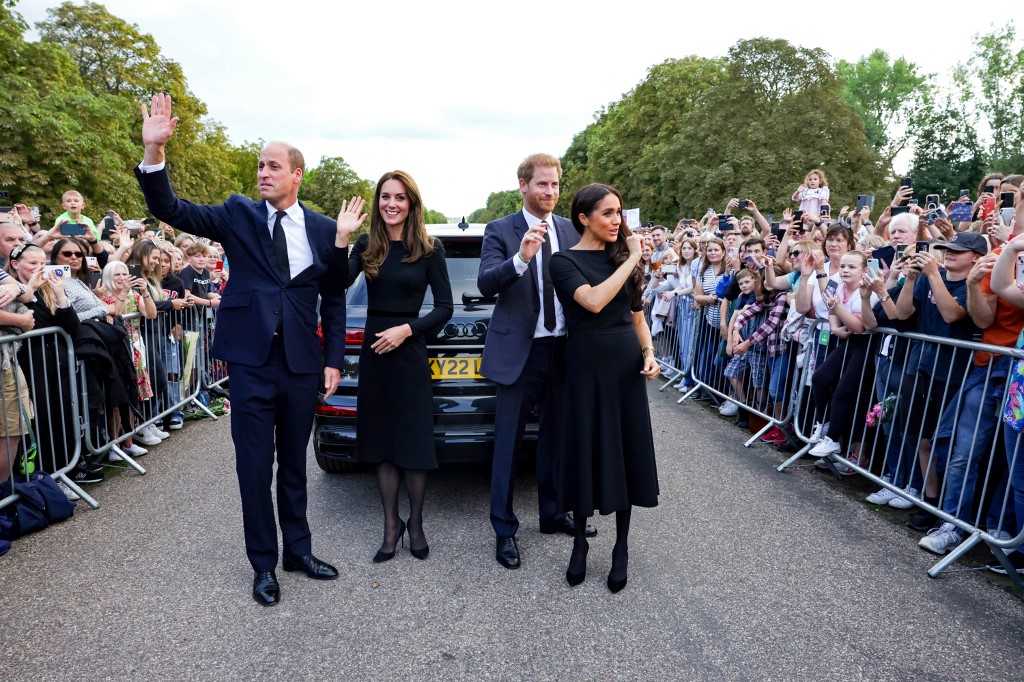 (From left) Britain's Prince William, Prince of Wales, Catherine, Princess of Wales, Prince Harry, Duke of Sussex and Meghan, Duchess of Sussex waving to the crowd after speaking to well-wishers on the Long Walk at Windsor Castle on September 10, 2022. – AFP pic