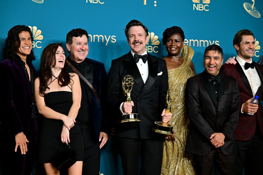 US actor Jason Sudeikis (centre), surrounded by the cast and crew of 'Ted Lasso' with the Emmy for Outstanding Comedy Series during the 74th Emmy Awards at the Microsoft Theater in Los Angeles, California, on September 12, 2022. – AFP pic