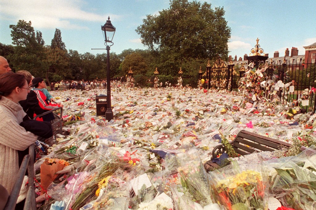 A park bench provides an accurate gauge of the volume of floral tributes in front of Kensington Palace in London on September 4 following the August 31 death of Diana, Princess of Wales, in a car crash in central Paris. – AFP file pic