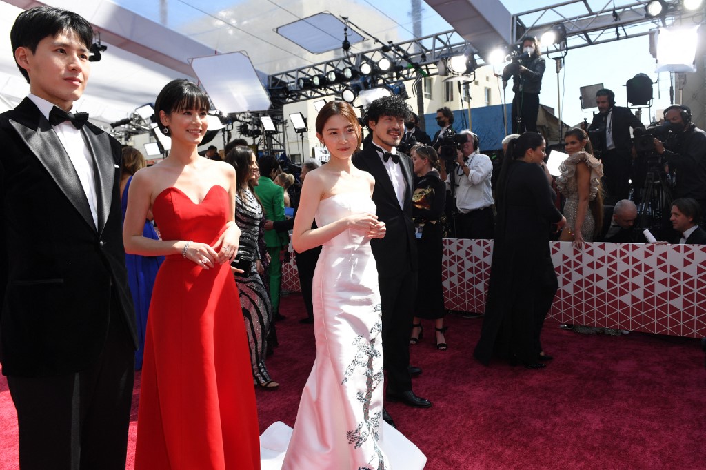 The cast of 'Drive My Car' (from left) Ahn Hwi Tae, Reika Kirishima, Park Yu Rim and Jin Dae Yeon at the Dolby Theatre. – AFP pic
