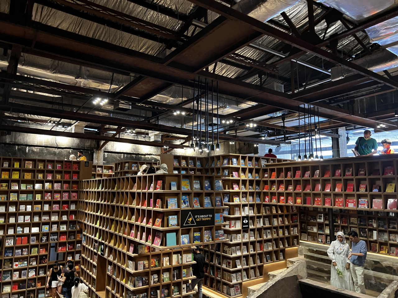 While it might not seem like it takes a lot of space, the bookstore is very vertical, with stairs aplenty. The books from this vantage look like they are arranged by colour, adding to the aesthetic appeal of the store. – Haikal Fernandez pic