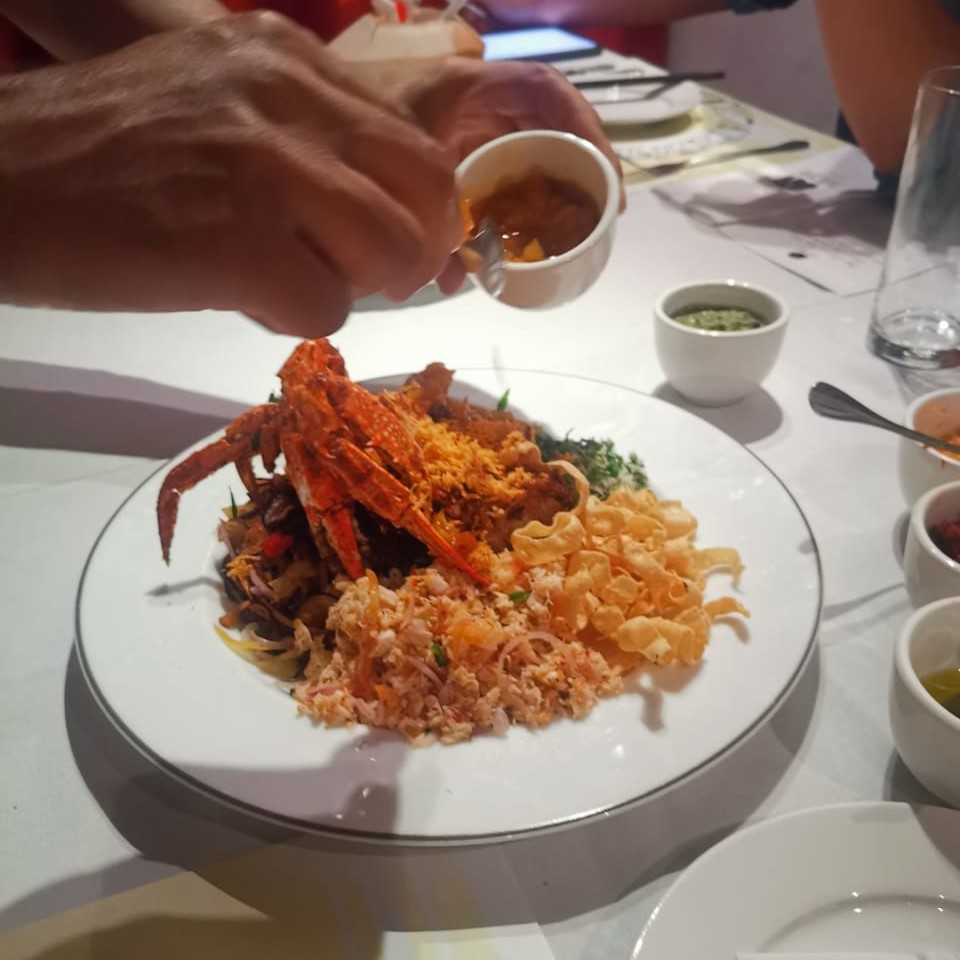 Though it looks different, ultimately the preparation and eating of this yee sang is the same as the traditional version. Other than the crab of course, which takes a fair bit of work compared to fresh fish. – Haikal Fernandez pic