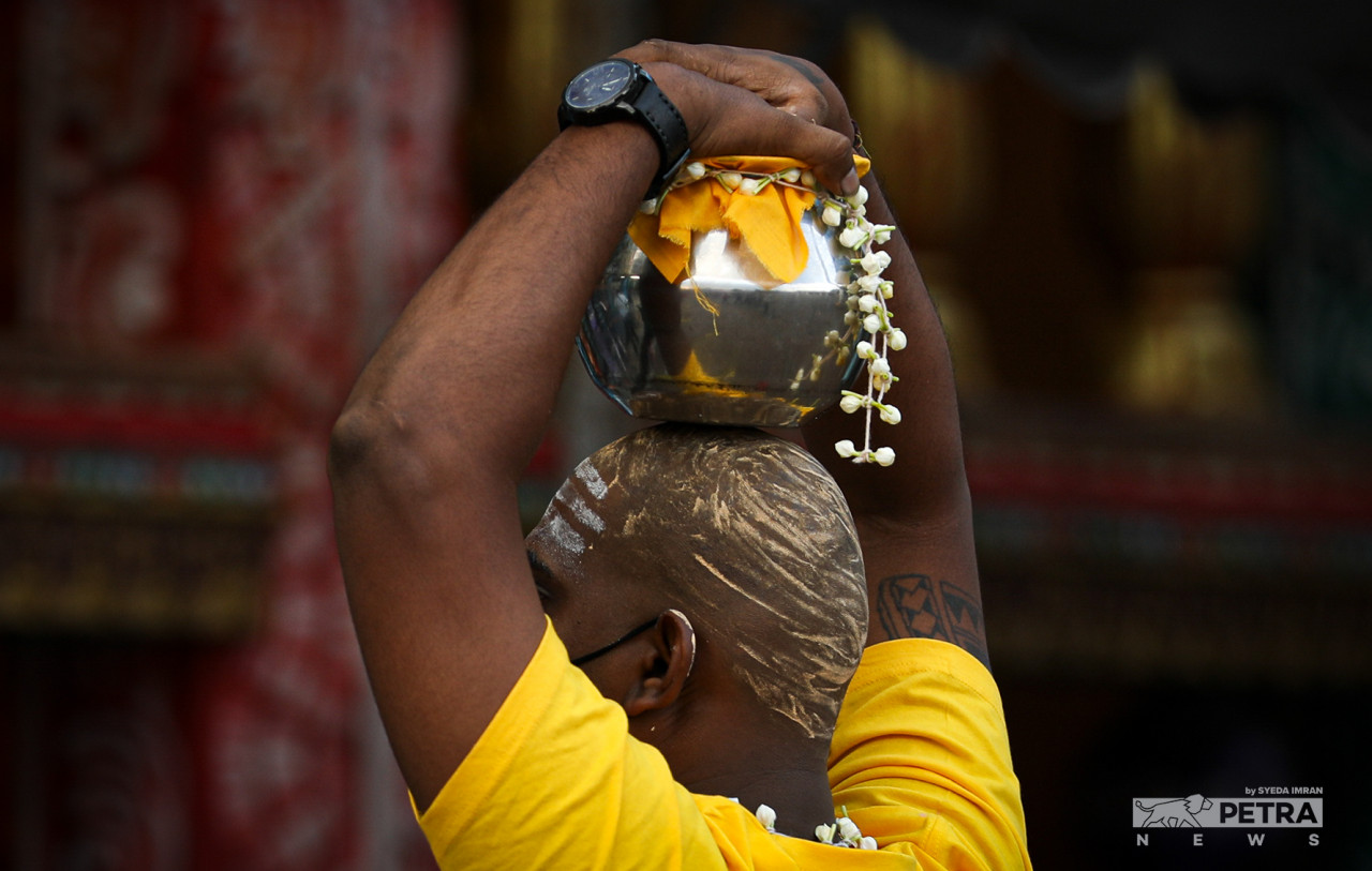 Devotees carry paal kudam during theThaipusam celebration as a symbol of their vows. – SYEDA IMRAN/The Vibes pic, January 18, 2022