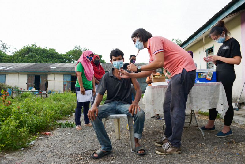 Meet the migrants and refugees behind Malaysia’s vaccination drive