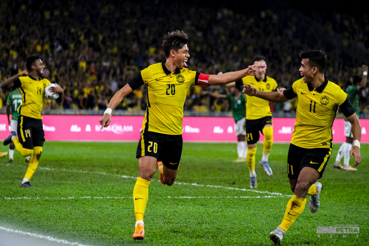 Muhammad Syafiq Ahmad (left) celebrates his success in scoring the third goal of the Malaysian team with Muhammad Safawi Rasid in the Group E Match, last Tuesday. – ABD. RAZAK LATIF/The Vibes pic, June 17, 2022