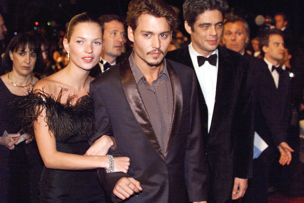 Johnny Depp (centre) and Benito Del Toro (right) accompanied by model Kate Moss (second from left) arriving at the Palais des festivals for the screening of the film 'Fear and Loathing in Las Vegas' by US director Terry Gilliam on May 15, 1998. – AFP file pic