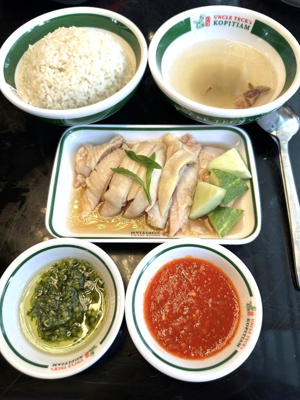 Uncle Teck's Hakka chicken rice seemed very much like the Cantonese and Hainanese chicken rice fare generally. It was difficult to pinpoint what ingredient in it staked its claim to its Hakka-ness. Perhaps, it was the special green dipping sauce that gave a zing to the tender boneless chicken when eaten with rice. – Marilyn Madrod pic