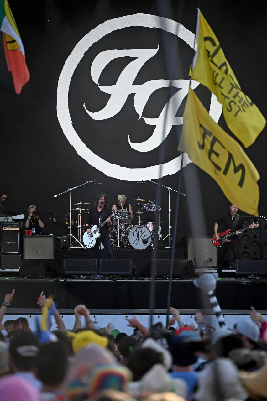 Foo Fighters' Dave Grohl (left), Josh Freese (centre), and Nate Mendel, performing a so-called secret slot on Friday. – AFP pic