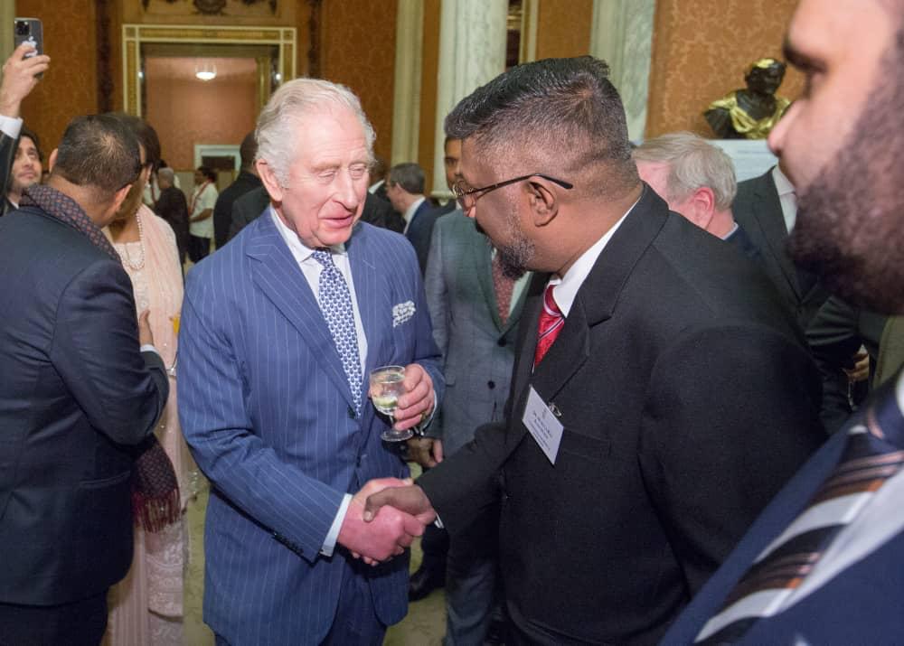 Dr Muruga greeting King Charles III at Buckingham Palace on March 13. – Facebook pic