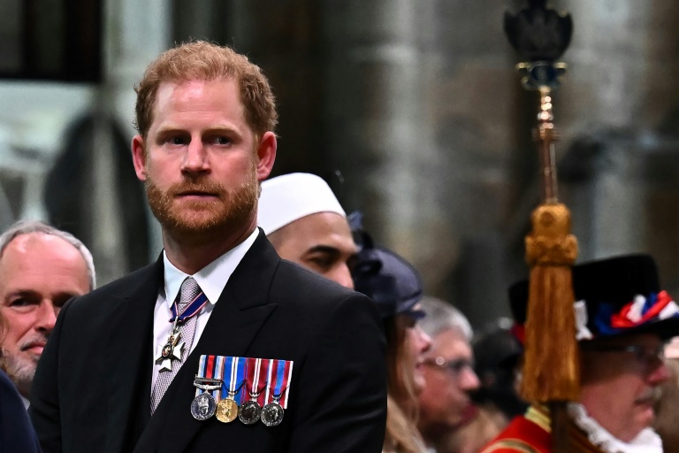 Charles's self-exiled younger son Prince Harry took no formal role. – AFP pic