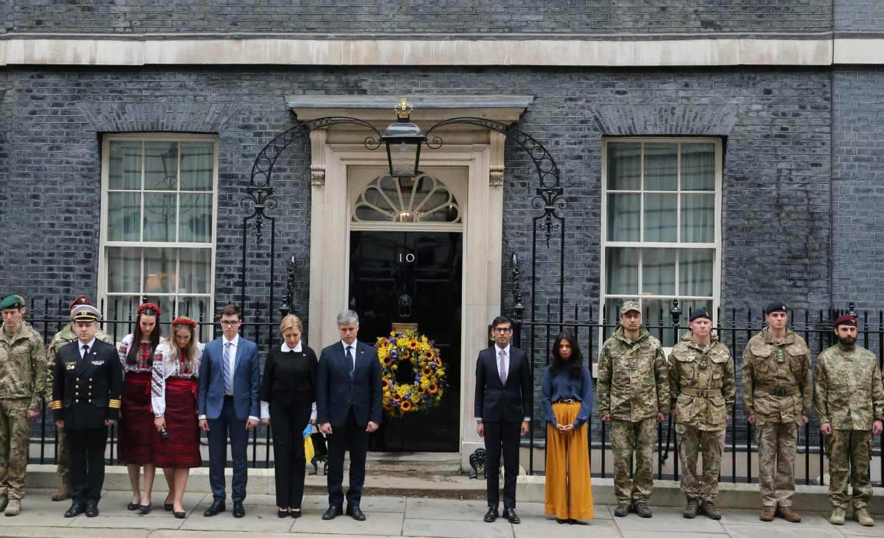 Ukraine's ambassador for Britain Vadym Prystaiko (seventh from left), his wife Inna Prystaiko (sixth from left), Britain's Prime Minister Rishi Sunak (sixth from right) and his wife Akshata Murty (fifth from right) stand outside 10 Downing Street, in London, during the National one minute’s silence to mark one year since the invasion of Ukraine by Russia, on February 24, 2023. – AFP pic, February 24, 2023