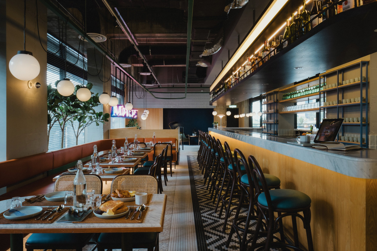 With plenty of wood, marble countertops, and exposed concrete ceiling, Monroe has a modern yet classic look. – Pic courtesy of Monroe