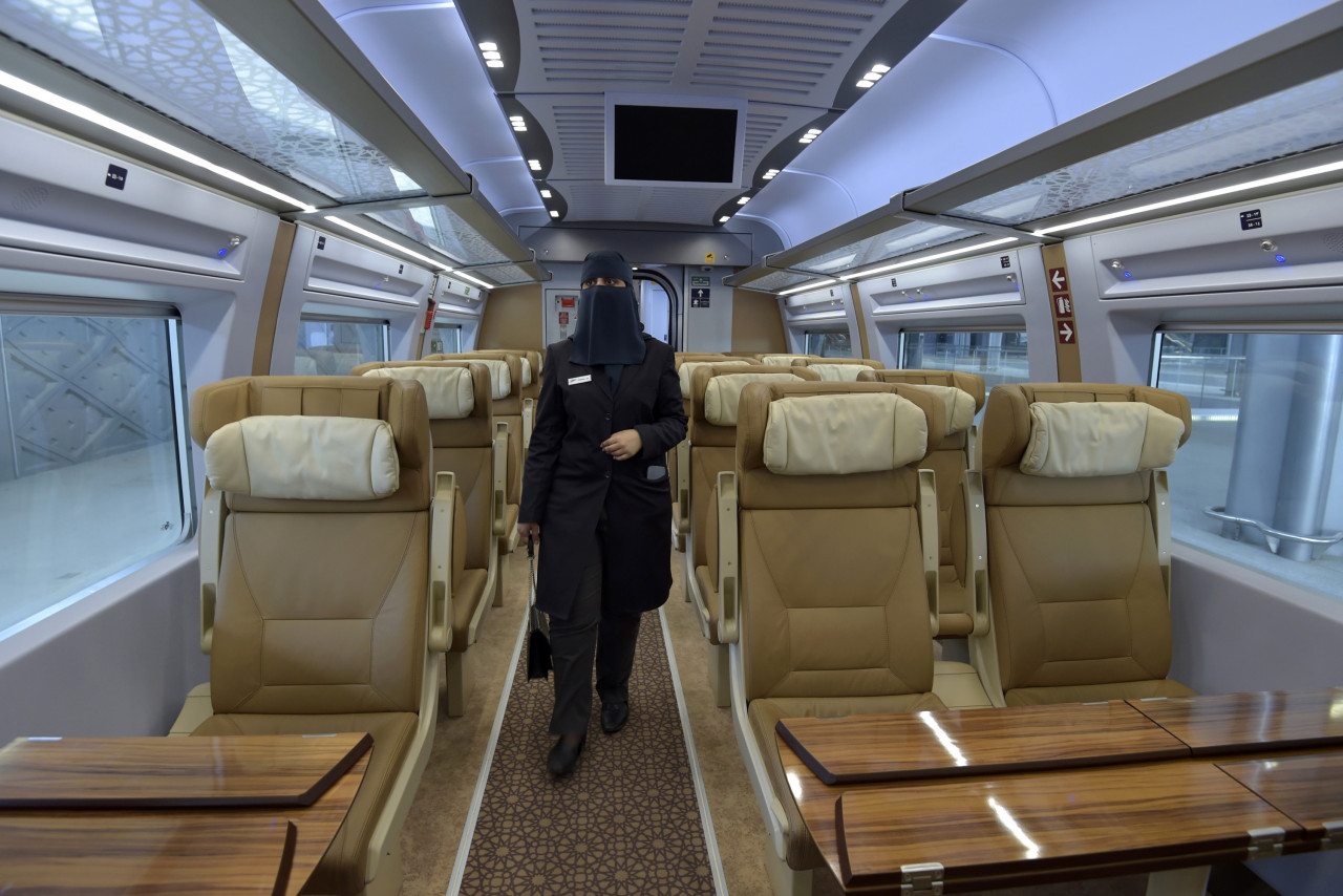 Saudi conductor Tharaa Ali, is pictured in one of the wagons of a high-speed train ferrying pilgrims to Mecca, in Saudi Arabia's Red Sea coastal city of Jeddah, on January 22, 2023. – AFP pic
