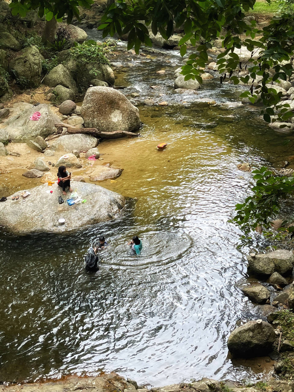 Visitors taking a dip at Sungai Lenggong. – Pic by Shireen Zainudin