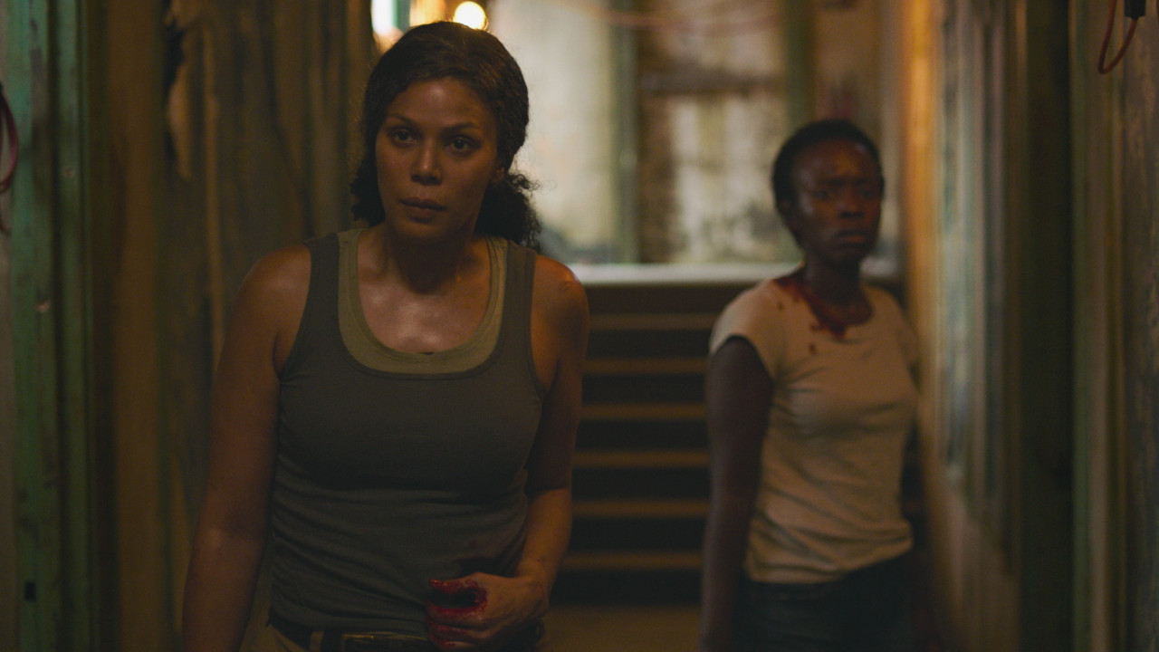 Merle Dandridge and Natasha Mumba play leaders of the Fireflies, a resistance group fighting against a fascist government in post-apocalyptic America. – Pic courtesy of Warner Bros