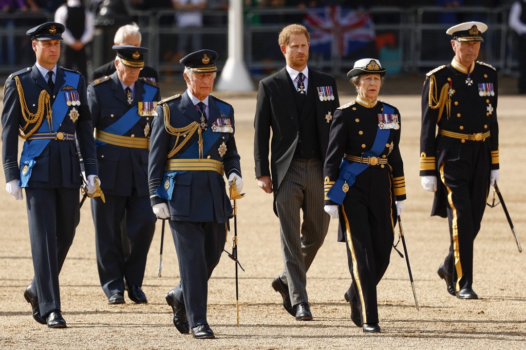 (From left) Prince William, Prince of Wales, King Charles III, Prince Harry, Duke of Sussex, Princess Anne, Princess Royal and Vice-Admiral Sir Timothy Laurence walking behind the coffin of Queen Elizabeth II, adorned with a Royal Standard and the Imperial State Crown and pulled by a Gun Carriage of The King's Troop Royal Horse Artillery, during a procession from Buckingham Palace to the Palace of Westminster, in London on September 14, 2022. – AFP pic