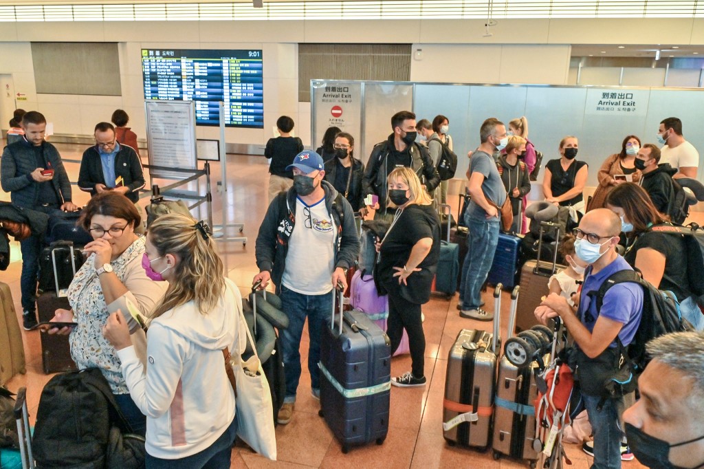 A group of tourists arrive at the international terminal of Tokyo's Haneda Airport on October 11, 2022, as Japan reopened to foreign travellers after two-and-a-half years of Covid restrictions. – AFP pic