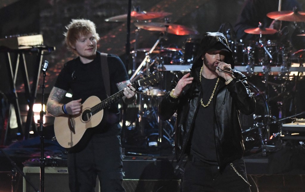 British singer/songwriter Ed Sheeran performs with inductee US rapper Eminem. – AFP pic