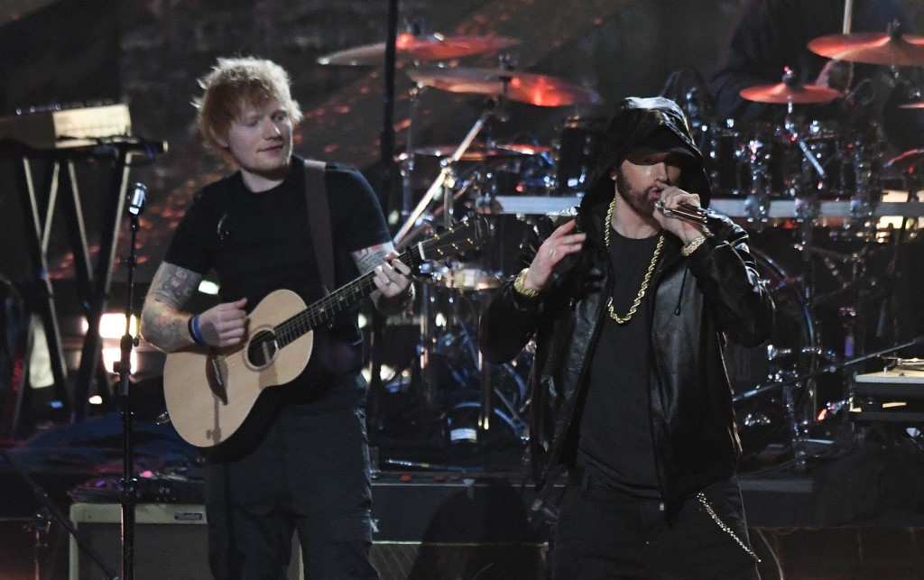 British singer/songwriter Ed Sheeran performs with inductee US rapper Eminem. – AFP pic
