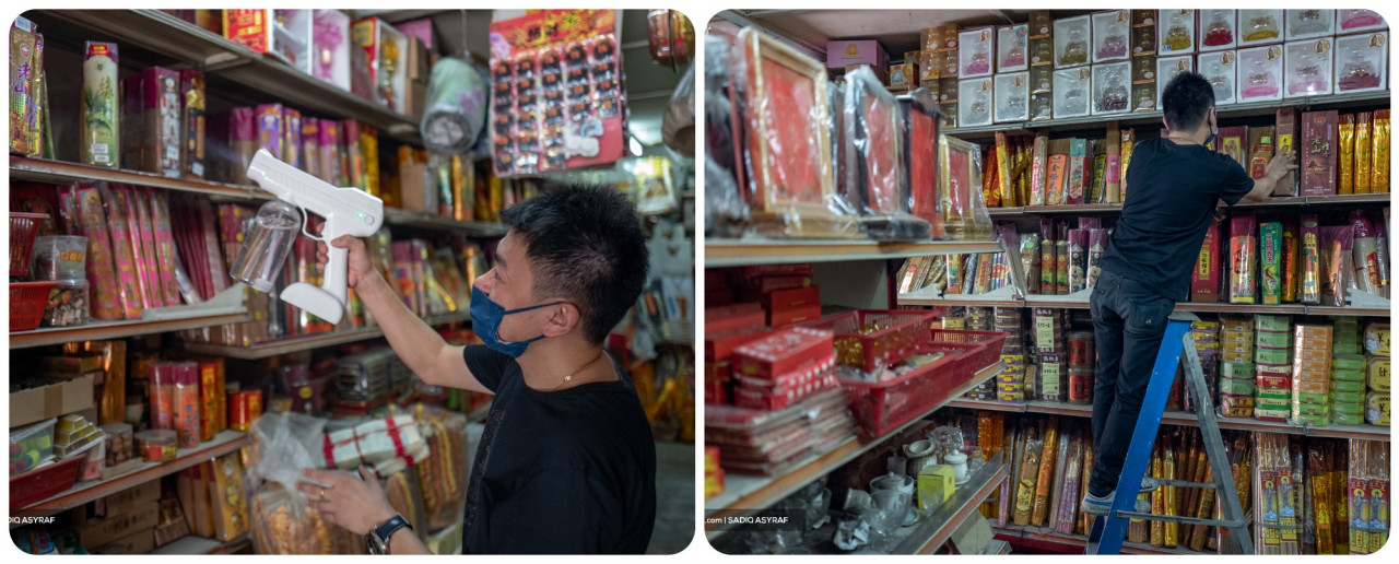 A shop attendee sorts and sanitises prayer goods at Len Heng Enterprise, a local Chinese prayer material shop that opened ahead of the celebration near the Nine Emperor Gods Temple in Ampang. – Sadiq Asyraf/The Vibes pic
