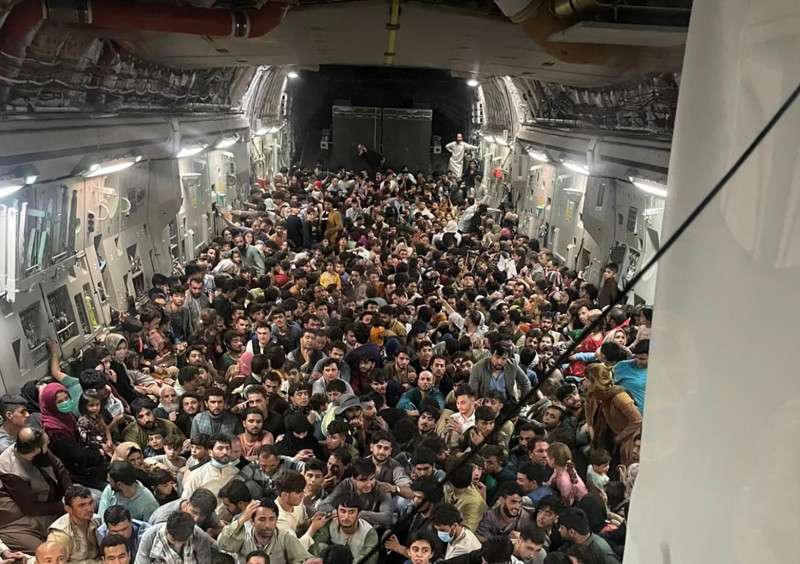 600 fleeing Afghans cram into dramatic US military flight