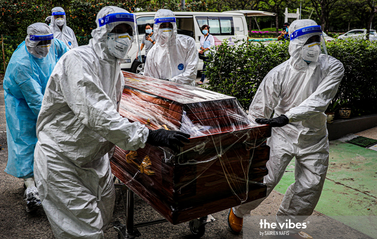 A coffin containing the body of a Covid-19 victim is brought to the Nirvana Memorial Park in Shah Alam. – The Vibes pic, February 4, 2021