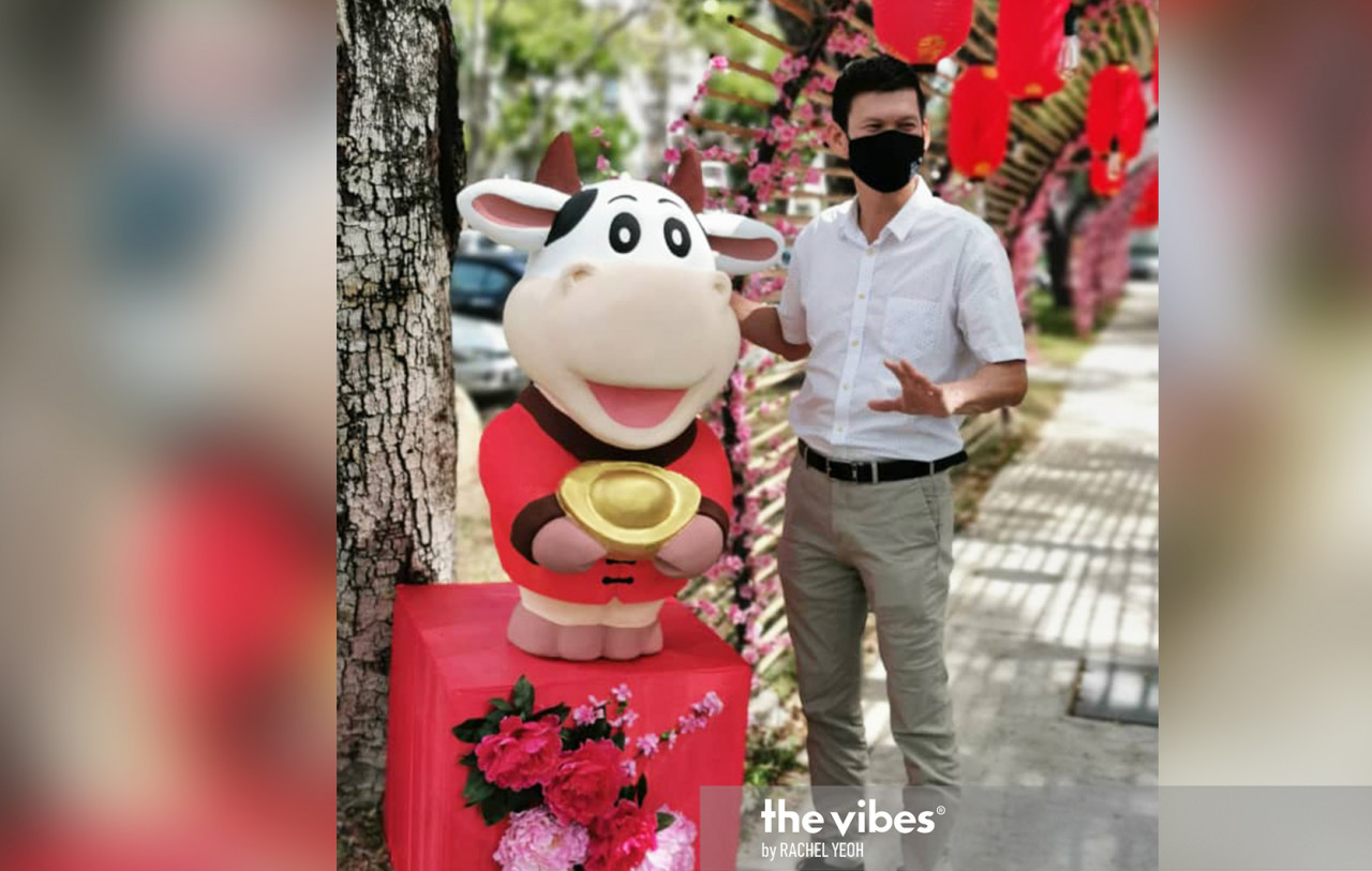 Batu Lanchang assemblyman Ong Ah Teong poses with a cow statue put up as part of CNY decorations in Penang. – RACHEL YEOH/The Vibes pic, February 11, 2021
