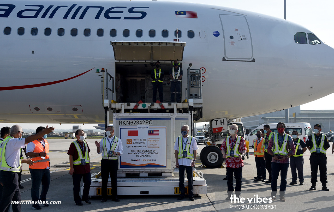 Ministers including Khairy Jamaluddin (right) on the tarmac to receive the Sinovac vaccine at KLIA this morning. – Info Dept pic, February 27, 2021