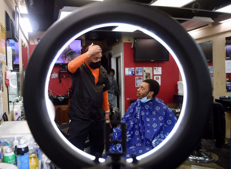 African-American barber snips Covid fictions