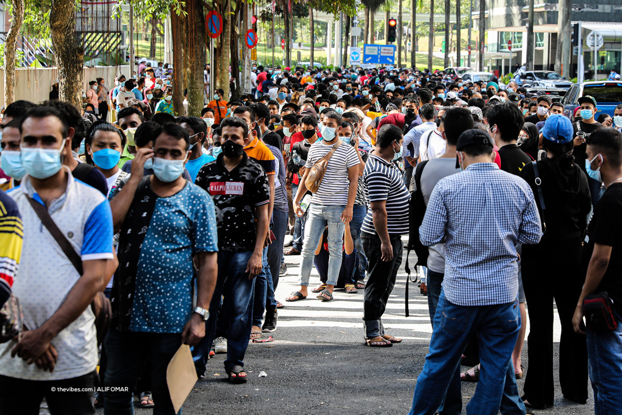 Foreigners waiting in line for walk-in vaccinations at the KLCC PPV recently. The government's efforts to jab the foreign workforce only came about after a spike in numbers and clusters among them were detected. – The Vibes file pic, August 31, 2021