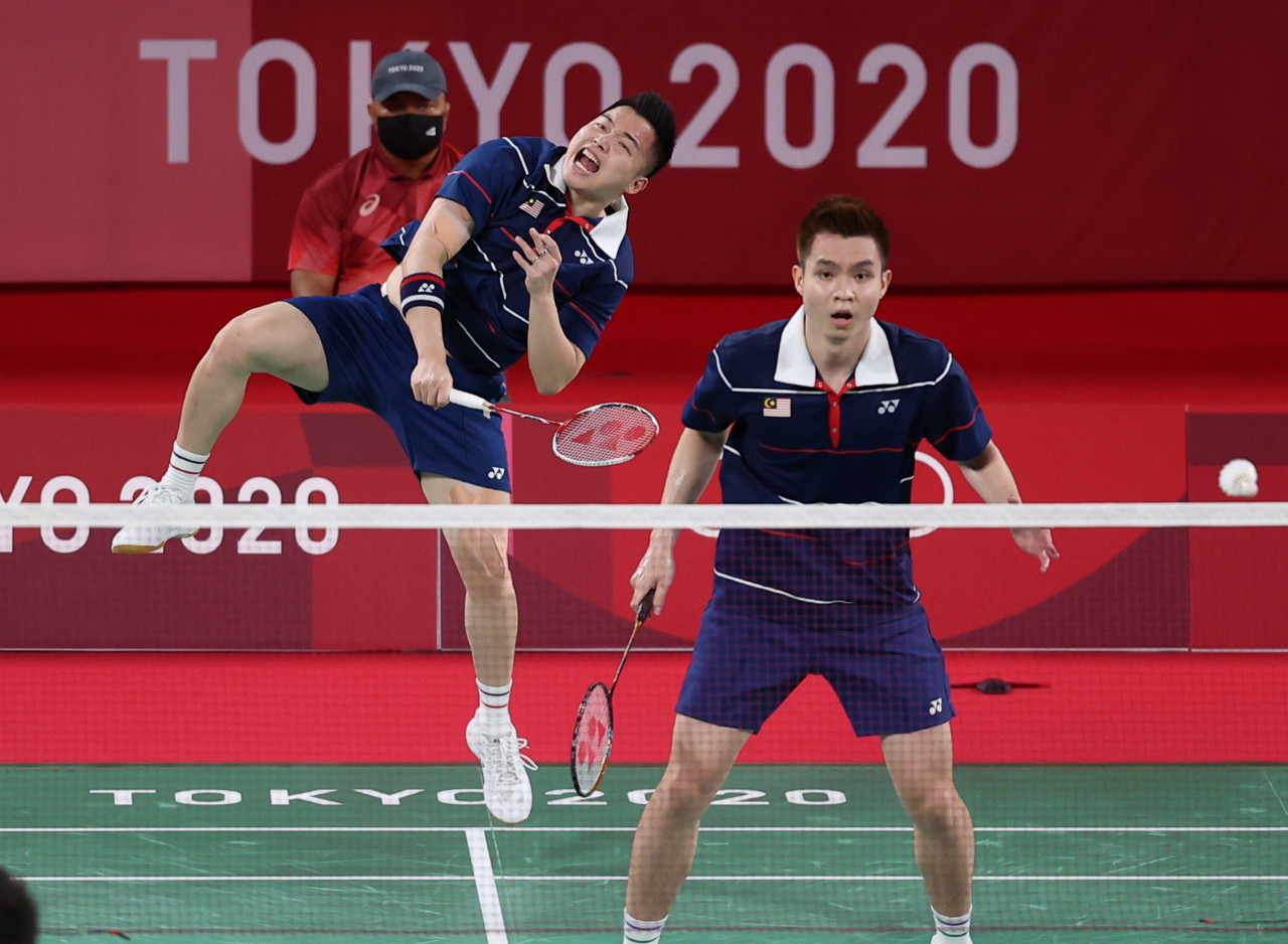 National badminton men’s doubles pair Aaron Chia (left) and Soh Wooi Yik compete at the 2020 Tokyo Olympics last year, where they won bronze. Despite badminton being one of the few sports where Malaysia has had world-class athletes, it has so far failed to deliver Olympic gold. – Bernama pic, October 8, 2022