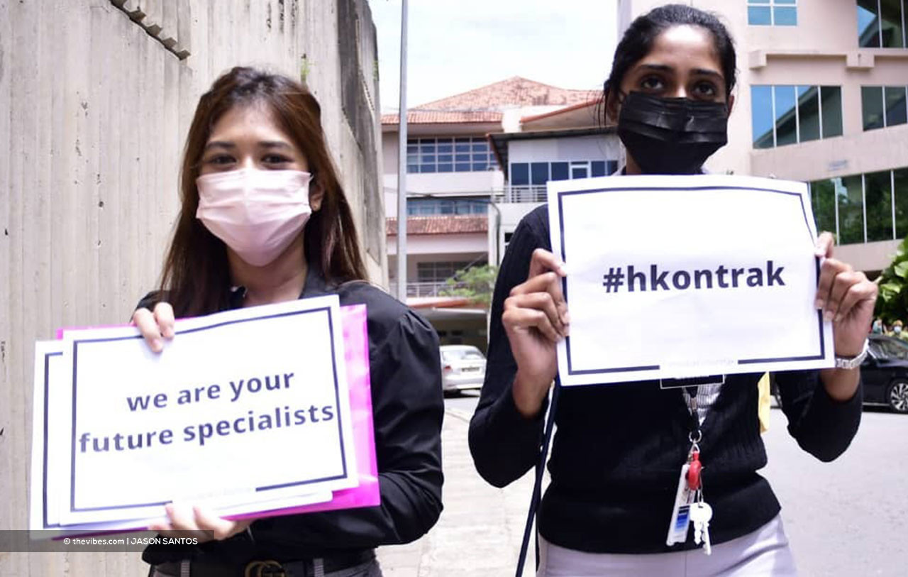 The two Queen Elizabeth Hospital doctors who participated in the #HartalDoktorKontrak demo. – JASON SANTOS/The Vibes pic, July 26, 2021