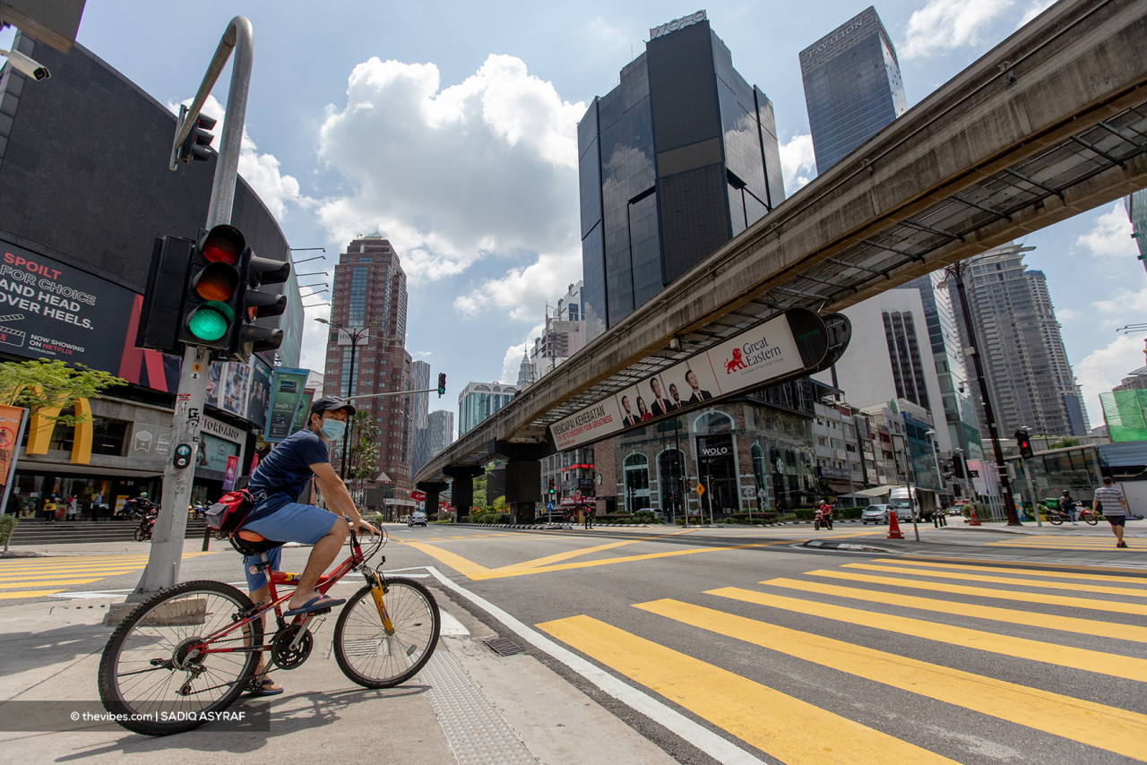 It is a good day for cyclists in Kuala Lumpur, whose roads are left largely empty due to the lockdown. – SADIQ ASYRAF/The Vibes pic, June 1, 2021