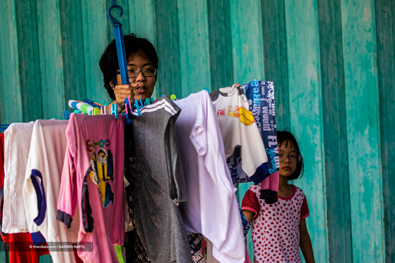 A woman doing household chores in Pasir Penambang. – The Vibes pic, June 6, 2021