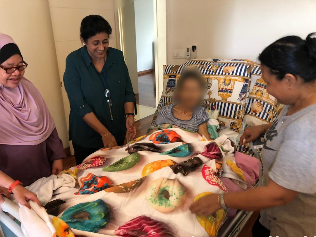 Dr Vanitha (second from left) and the Kasih Hospice team visiting a patient. – Kasih Hospice pic