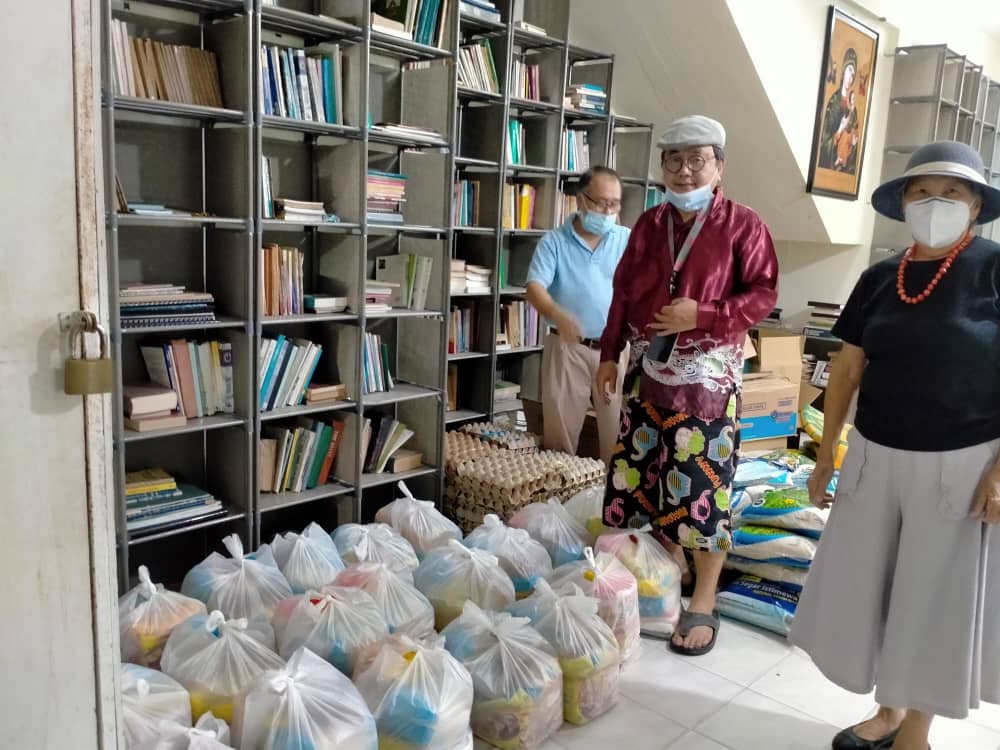 Well-wishers donated packets of groceries on Friday to Fr Sylvesterding's food bank. - Fr Sylvesterding