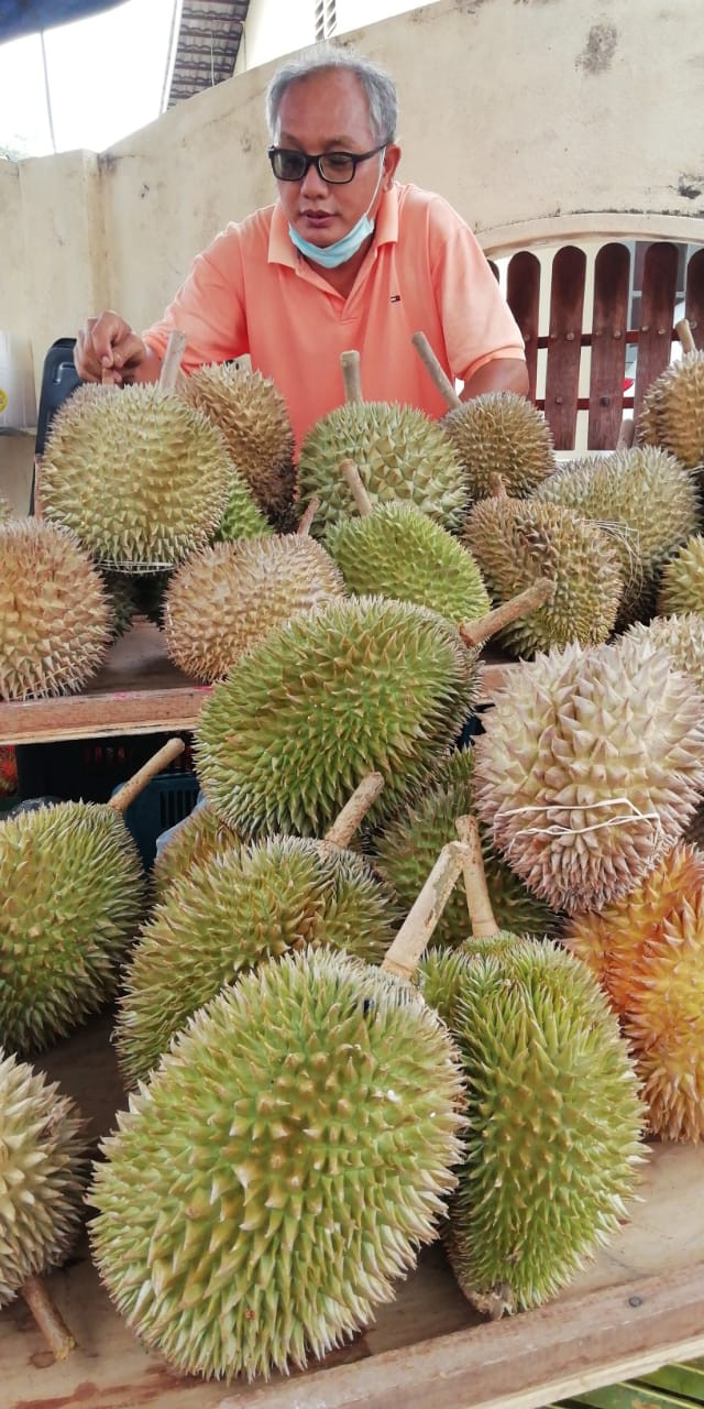 Hoe Eng Kuang looks over his daily supply of durian. – Pics courtesy of Hoe Eng Kuang and Manjit Singh