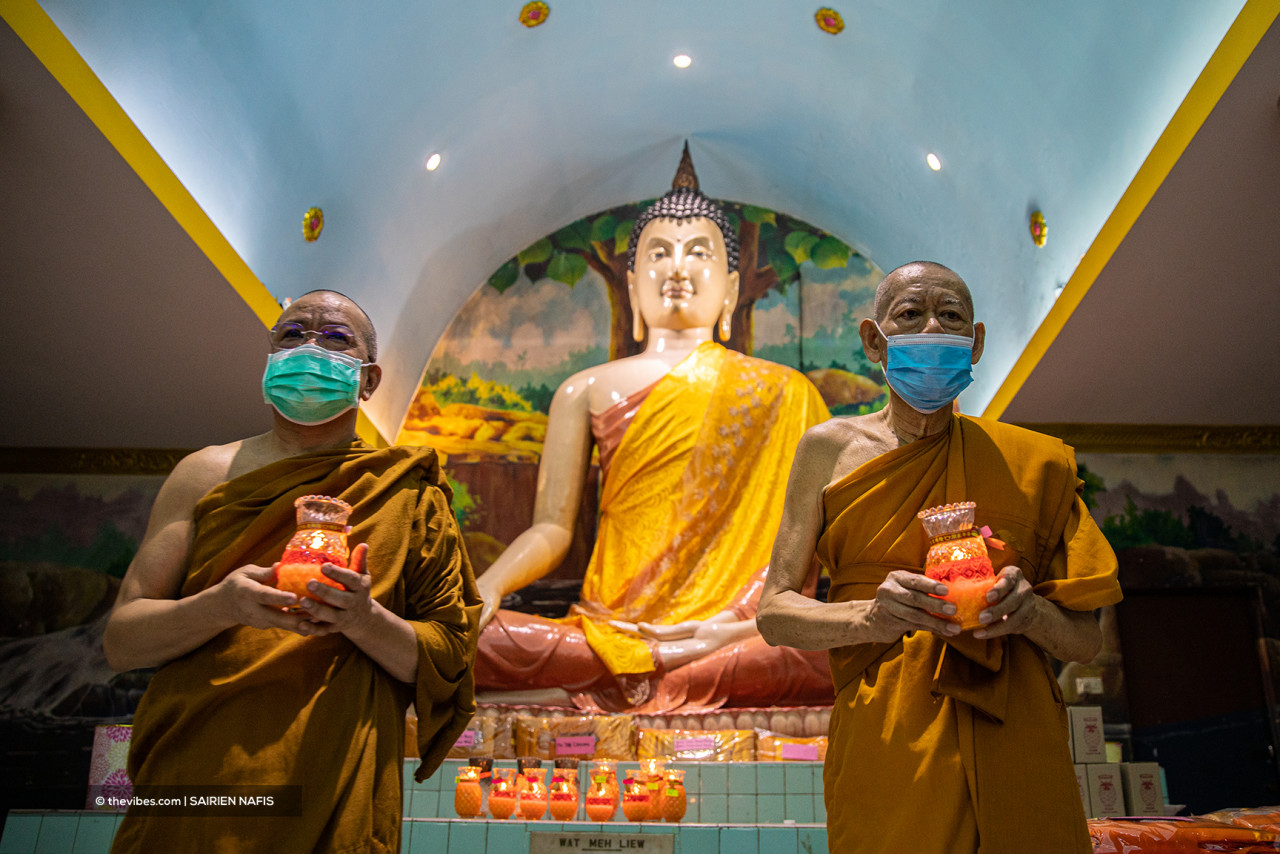 Although monks Apol (left) and Photanpoh miss the presence of devotees on Wesak Day this year, they say health and safety are the priority. – The Vibes pic, May 26, 2021