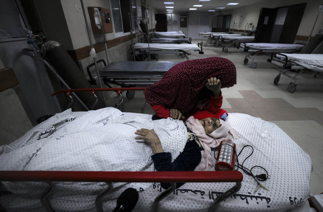 A Palestinian girl weeps next to her wounded grandmother at Al-Shifa Hospital in Gaza City today, following airstrikes by Israel. – AFP pic, May 15, 2021