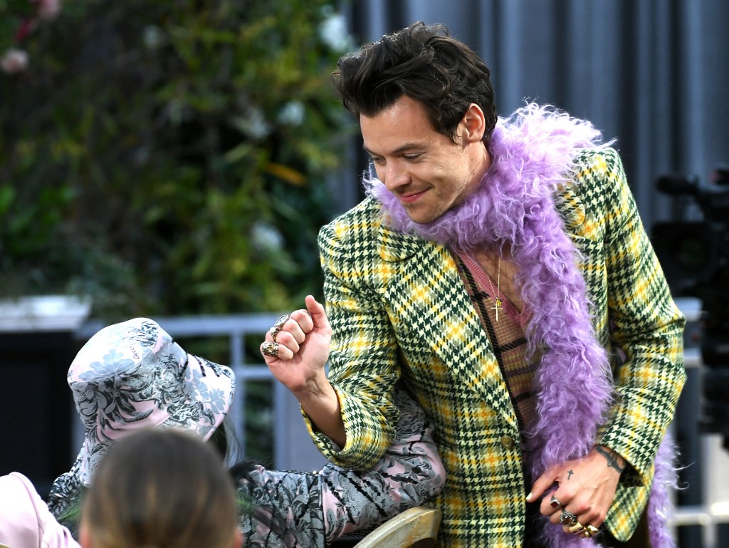 British singer Harry Styles bumps elbow with US singer Billie Eilish as they attend the 63rd Annual Grammy Awards at Los Angeles Convention Centre yesterday in Los Angeles, California. – AFP pic